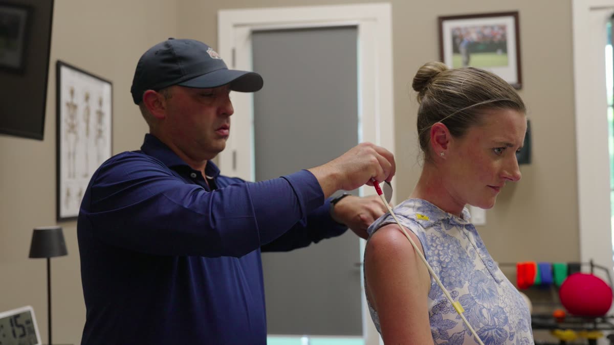 A range-of-motion assessment being performed in a private treatment room at REM Performance.